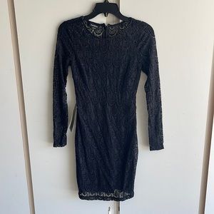 Brand new Bebe lace with 2 piece lining, mid section has a sexy peekaboo:)!